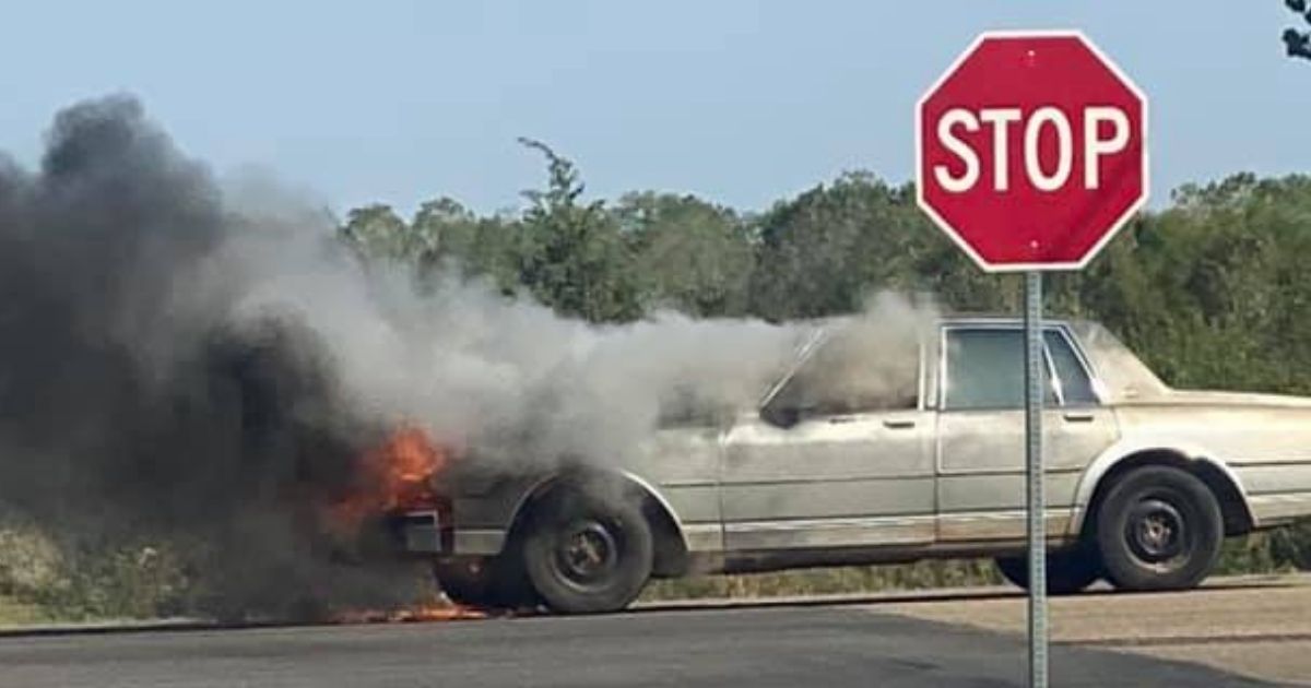 Woman Sitting in Broken-Down Car Doesn't Know It's on Fire: Good Samaritan Saves the Day