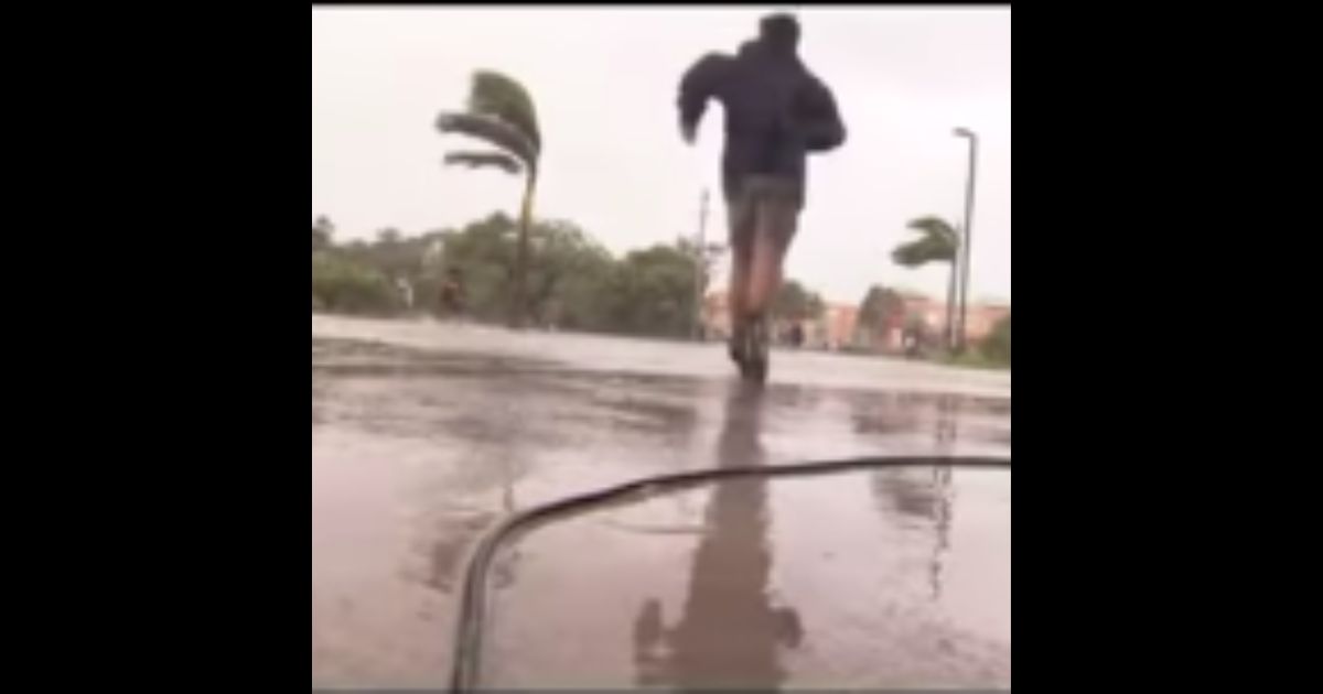 Cameraman Drops His Camera and Sprints to Help Family in Distress During Hurricane Ian Live Shot
