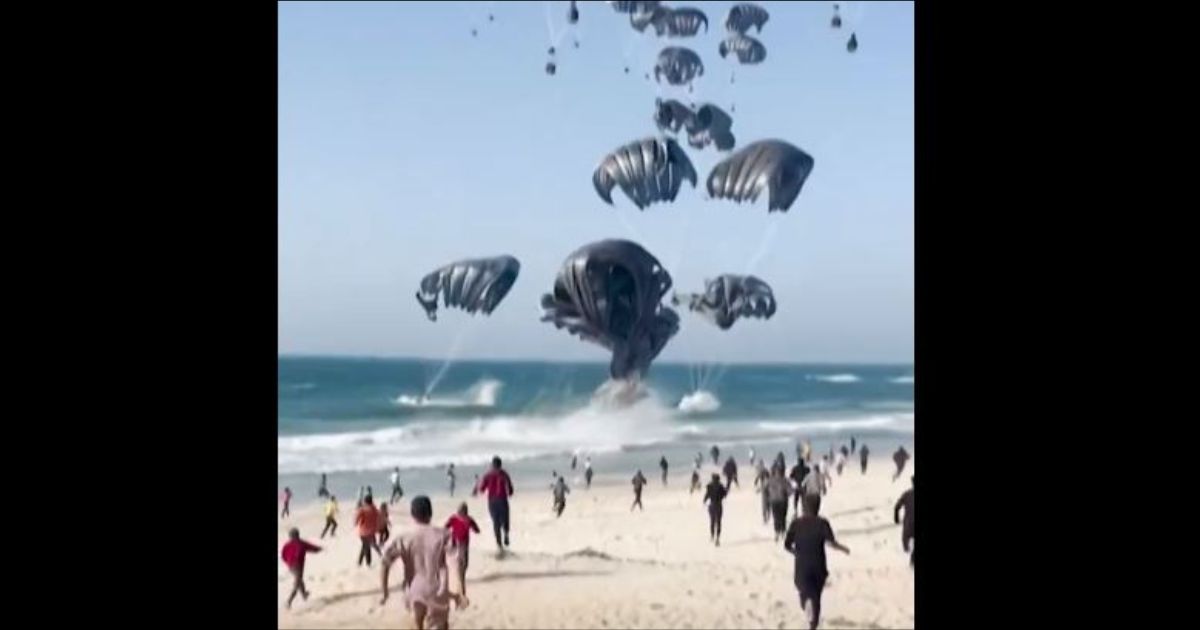 Watch: Palestinian Civilians Swarm Thousands of Air-Dropped Meals from the US