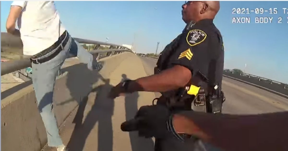 Watch: Police Officers Make Heroic Rescue of Suicidal Man on Bridge