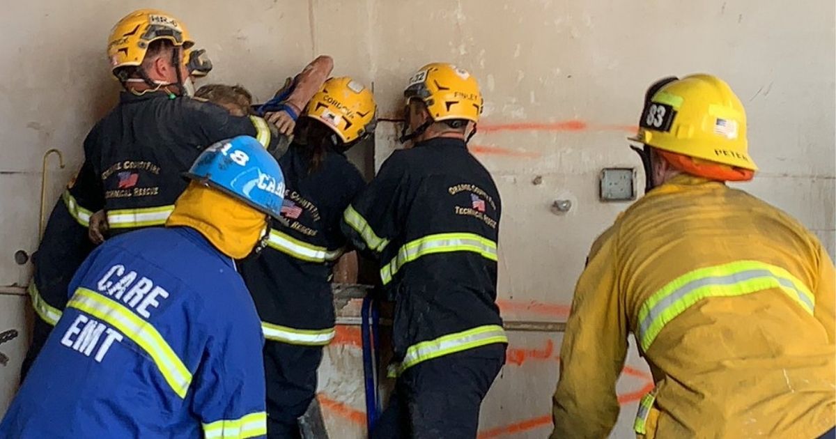 After Workers Hear Screaming, Firefighters Spend Over Two Hours Freeing Woman Trapped Between Buildings