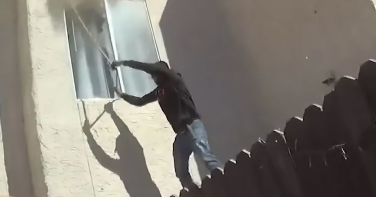 Hero Risks Life Climbing Through Broken Second-Story Window to Save Two Children and a Dog from Fire