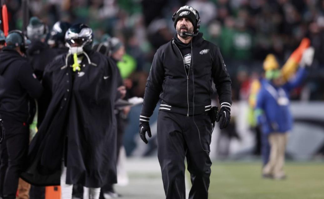 NFL Coach Restrained By Security After Exchange With Player