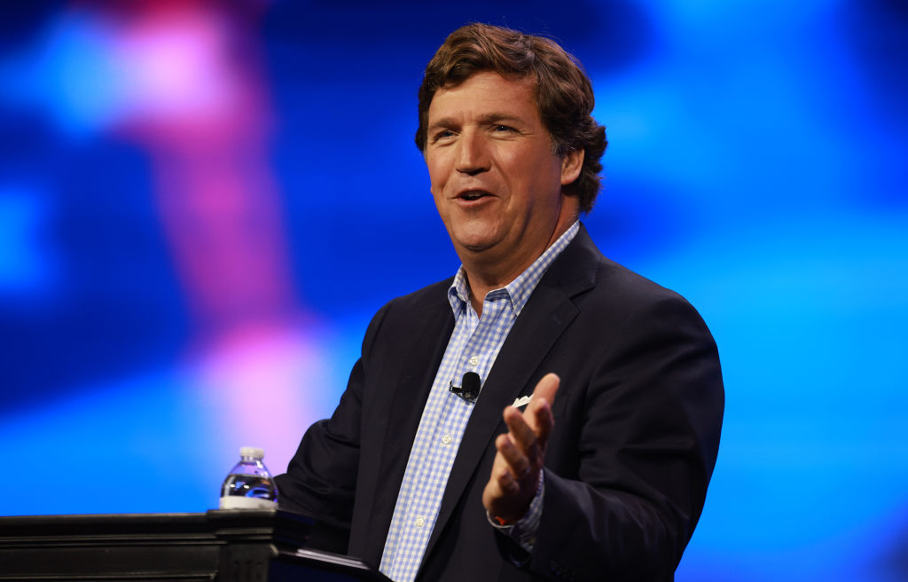 Tucker Carlson Parks Trucks Outside of News Outlets with Message to Establishment Media