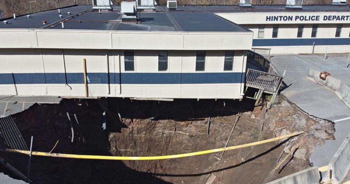 Watch as Police Station Teeters on the Edge of Collapse After Sinkhole Opens Underneath it in West Virginia