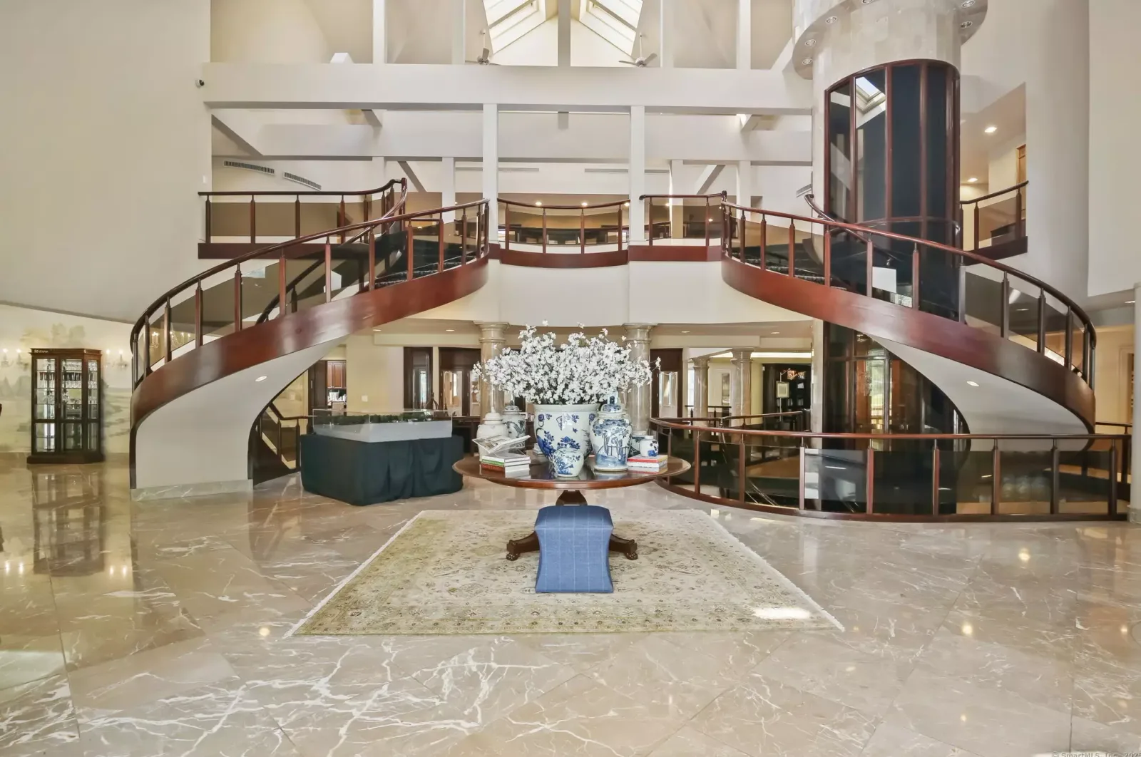 The grand foyer, with its curved double staircase.