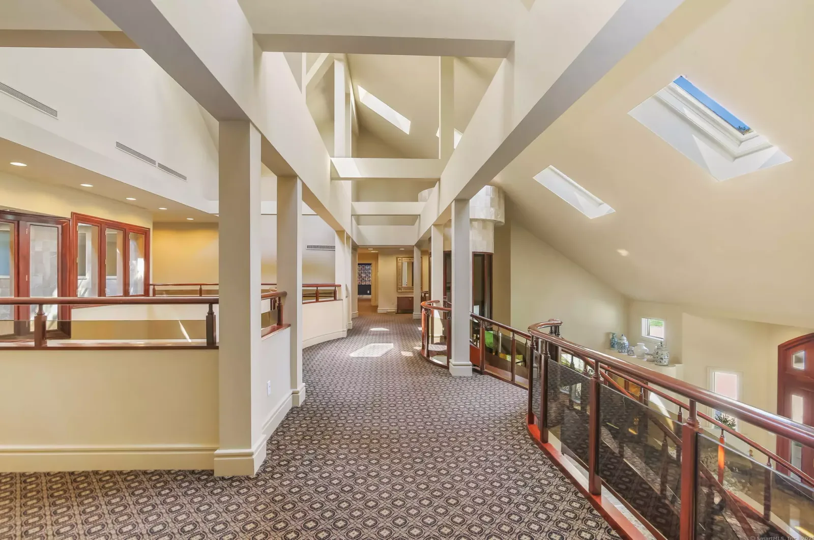 An upstairs gallery hallway under skylights.