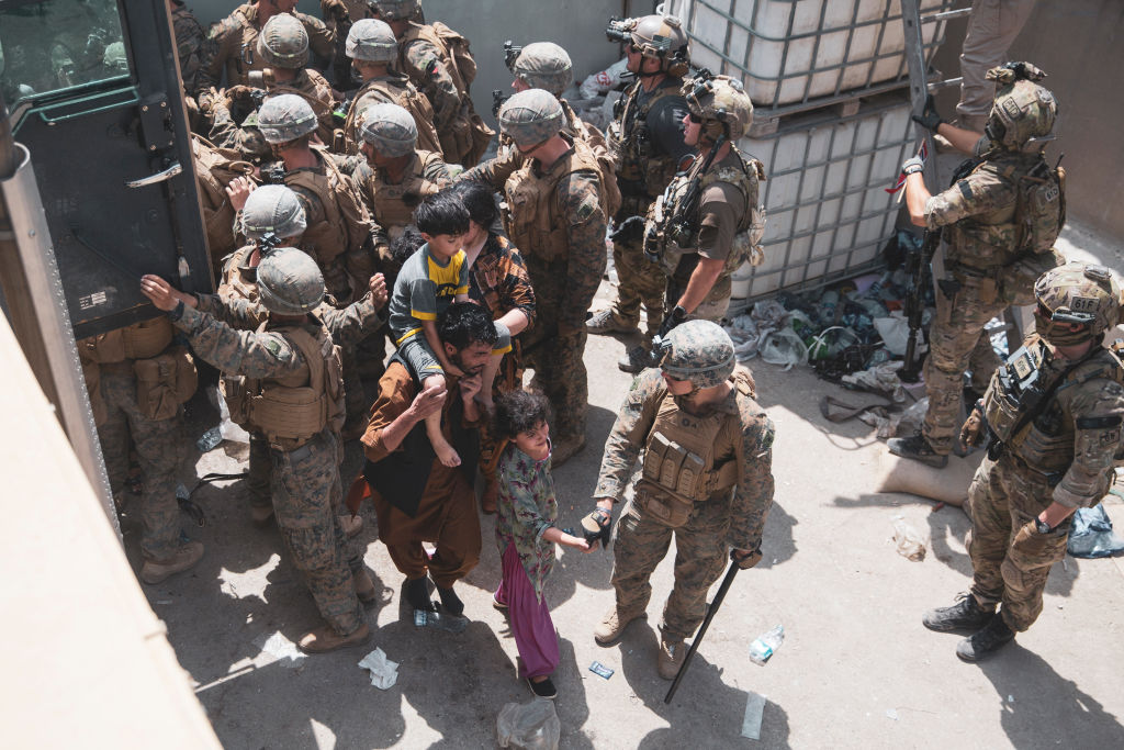 Marine Who Pulled Baby Over Wall at Kabul Airport Now Under Investigation for Appearing at Trump Rally