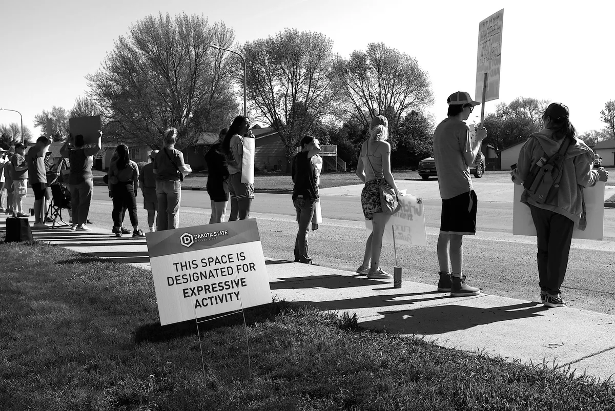 Students walk out, question campus shooting communications