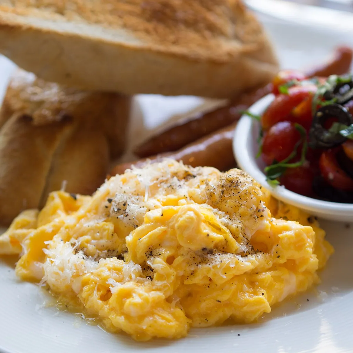 Low heat and gentle folding keep scrambled eggs tender
