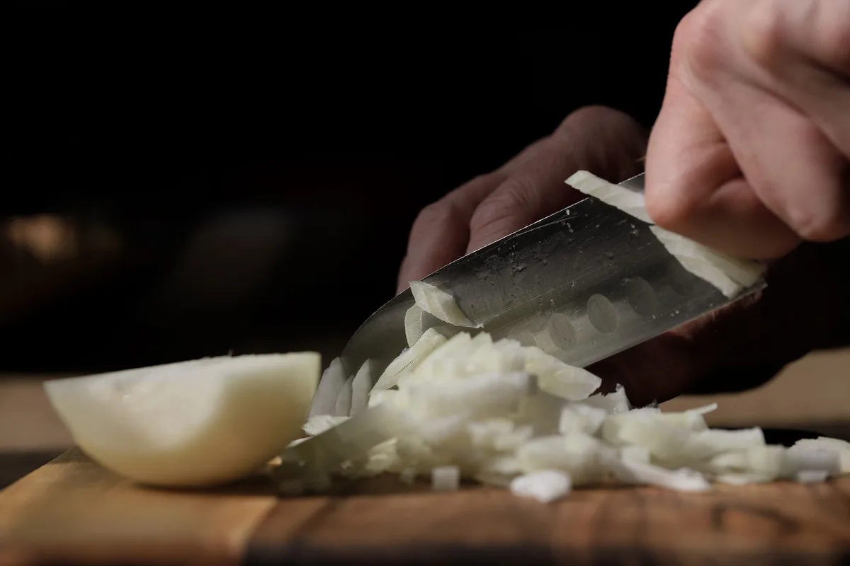 Keep the onion root intact for uniform dice