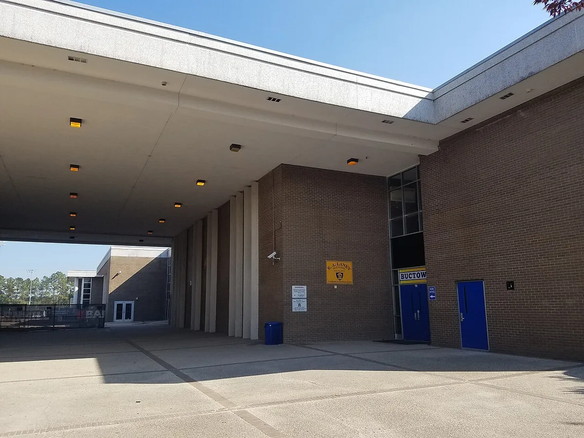 Woman arrested after three wounded in Laney High School tailgate shooting